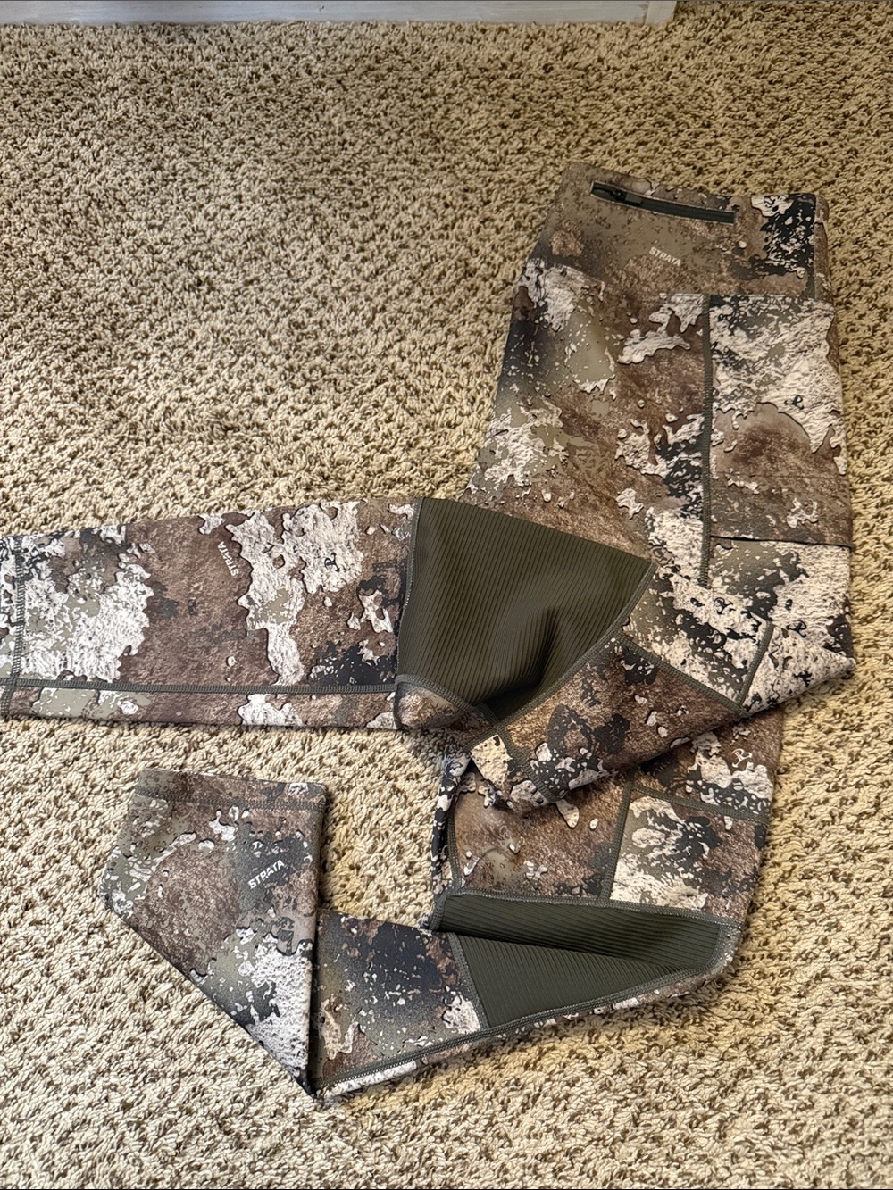 These SHE Outdoor women's trail pants with camo pattern and reinforced knee